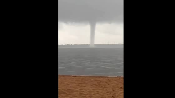 Russians grill meat unfazed by approaching tornado