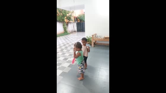 Playful twist: child keeps 'eyes on the ball literally"