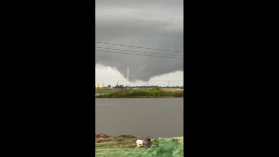 Tornado forms in distance amid heavy rain in Oklahoma, USA