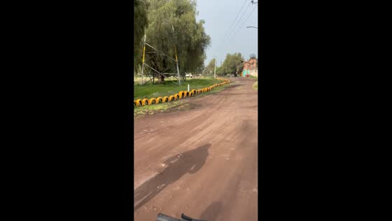 Cyclist falls after losing balance on rough road in Teotihuacan, Mexico