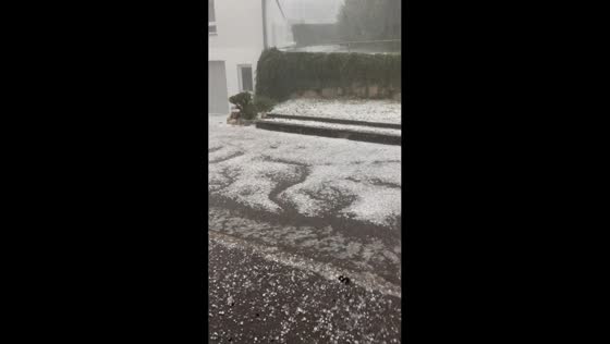 Massive hail accumulation turns streets white after severe storm in Reutlingen, Germany