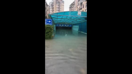 Heavy rain floods entrance to underground parking garage in Jiangsu, China