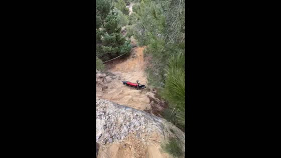 Enduro riders struggle to navigate a challenging rocky trail during competition in Golmayo, Spain