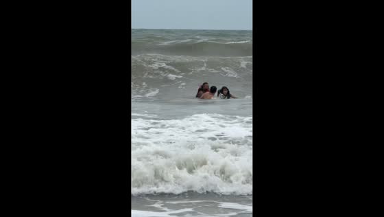 Rescuers save woman after jet ski overturns in rough seas in Guangxi, China