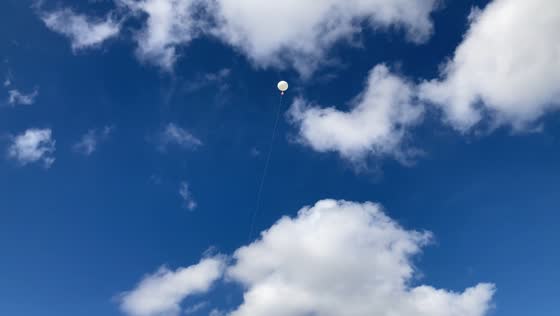 Meteorologists launch weather balloon for atmospheric data collection in Miami, Florida, USA