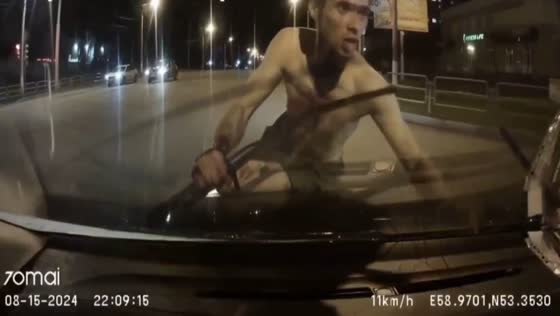 Young man with bloody face throws himself on car hood in Magnitogorsk