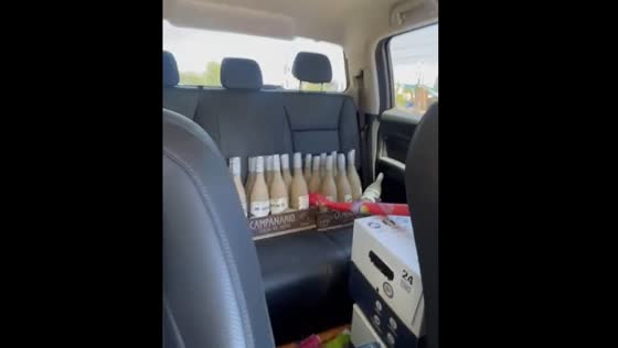 Person shakes bottles in car to Christmas jingle bells in Viña del Mar, Chile