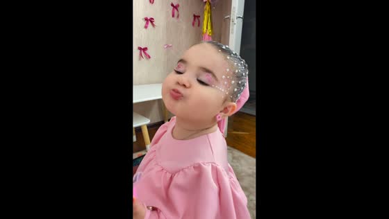 Baby makes kiss gesture after using pacifier in Saint Petersburg, Russia