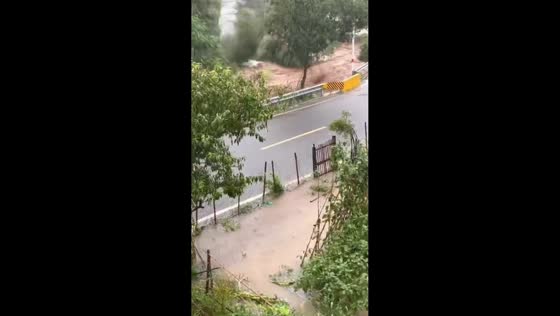 Flash flood sends muddy water and debris through Changxing in Zhejiang, China