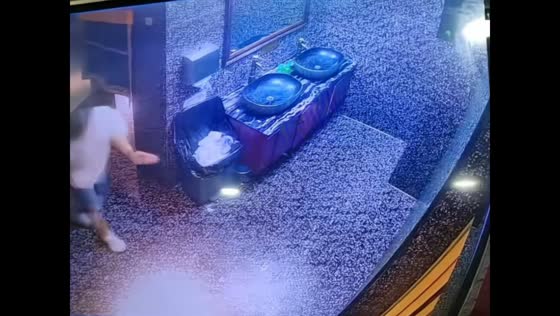 Man slips and pulls sink loose while dancing in restroom in Chongqing, China