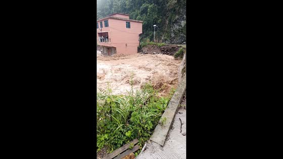 Severe flooding beside a bridge in Yunnan, China