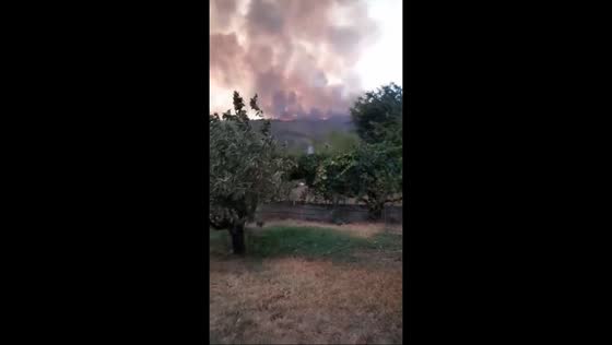 Thick smoke from Jarilla wildfire visible over Jerte River and Valley in Plasencia, Spain
