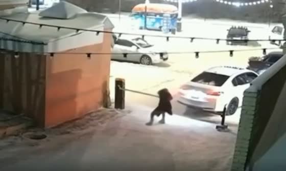 A drunk woman smashes a plastic barrier at a bar in Russia