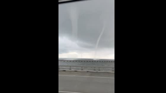 Double water spouts near Twin Span Bridge, New Orleans