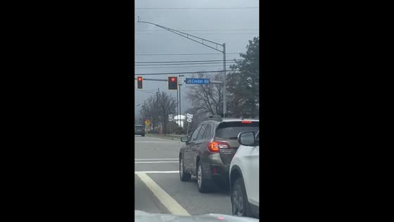 Traffic sign falls during windy weather in Brunswick, Ohio, USA
