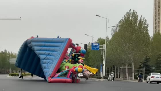 Inflatable playground swept by strong wind at intersection in Henan, China