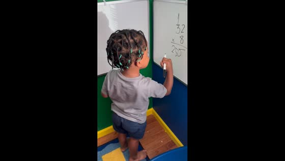 Young boy solves multiplication problem with confidence in Ohio, USA