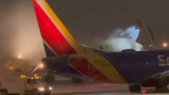 Aircraft de-icing at Rochester Airport amid winter weather in Rochester, New York, USA