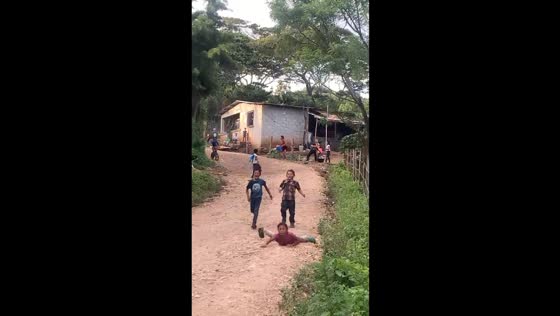 Kid on bicycle accidentally knocks girl while running downhill in Jutiapa