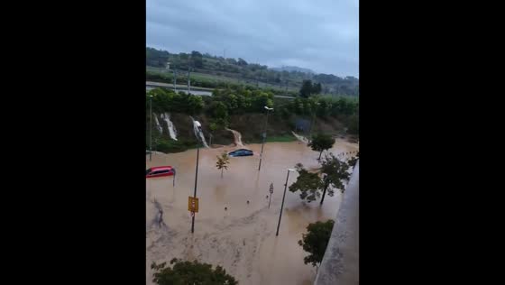 Torrential rain floods highway and submerges vehicles in Granollers, Spain