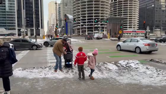 Snow buildup creates slippery pedestrian hazards in Chicago, Illinois, USA