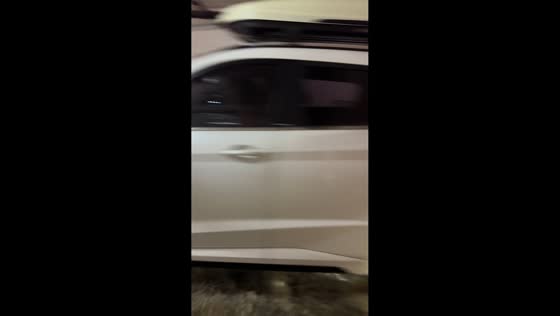 Vehicles drive out as murky floodwaters cover parking garage in Jiangsu, China
