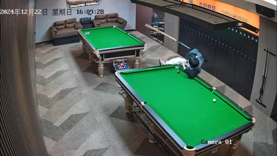 Man falls after attempting tricky billiards shot in Zhejiang, China