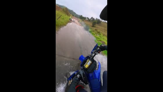 Motorcycle riders slip at First Creek Crossing in Australia