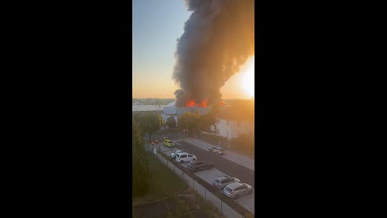 Massive warehouse fire engulfs electric scooter storage facility in Čelákovice, Czech Republic