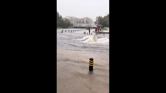 Flooded street erupts into geyser during Typhoon Bavi rain in Liaoning, China