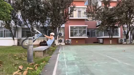 Cyclist fails wheelie trick and lands on bench in Jiangsu, China