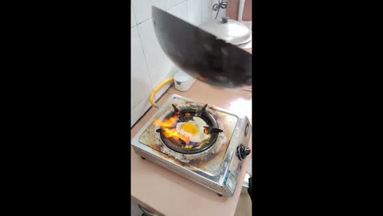 Egg falls into stove fire during cooking mishap in Guangdong, China