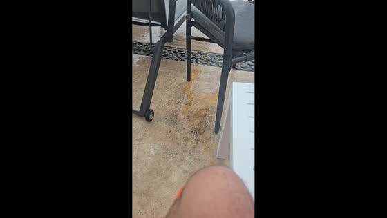 Strong winds send lounge chairs into pool during storm in Cancun, Mexico