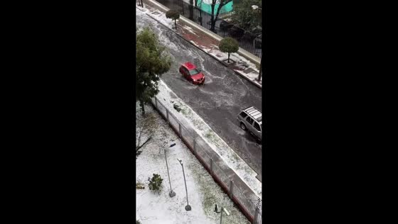 Heavy hailstorm turns streets into icy waterways in Bogotá, Colombia