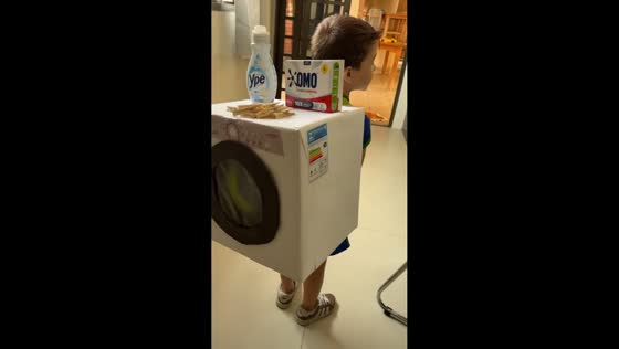 Kid shows off creative washing machine backpack in Santo Anastácio, Brazil