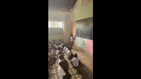 Children practice reading the syllabary in Zanzibar, Tanzania