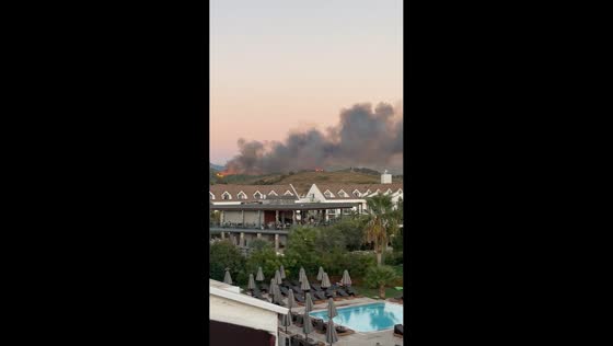 Raging wildfire tears across hillside near homes in Fethiye, Turkey
