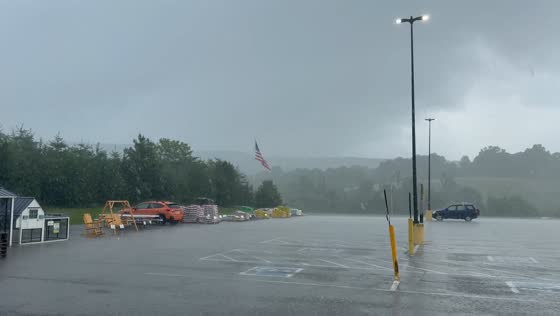 Snow and rain fall over parking lot in Livingston, Tennessee, USA