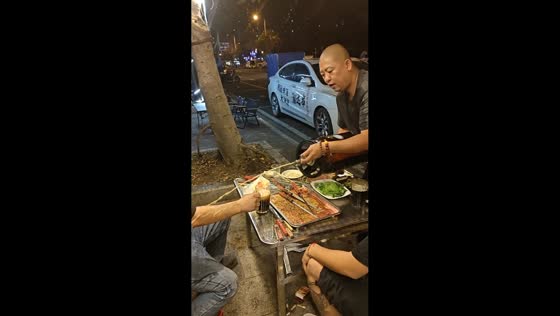 Man gets sprayed by mini keg during barbecue mishap in Hainan, China