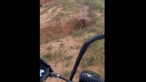 Motorcyclist falls into ditch after losing control on sand patch