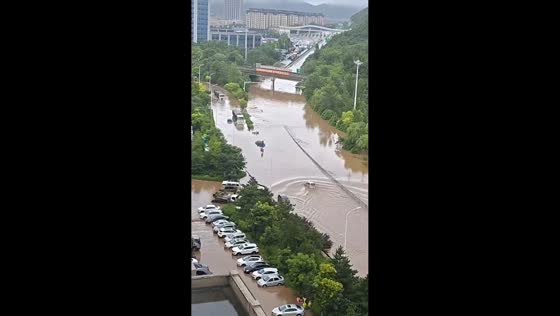 Severe flooding submerges vehicles on roadway in Hebei, China