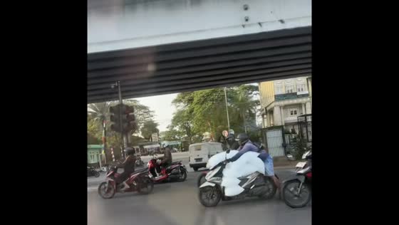 Overloaded motorbike spotted on road in Penang Island, Malaysia
