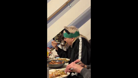 Dog cheekily steals food at the table in Burton, United Kingdom