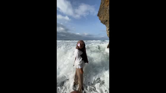 Teens swept by wave during beach video in Yogyakarta, Indonesia