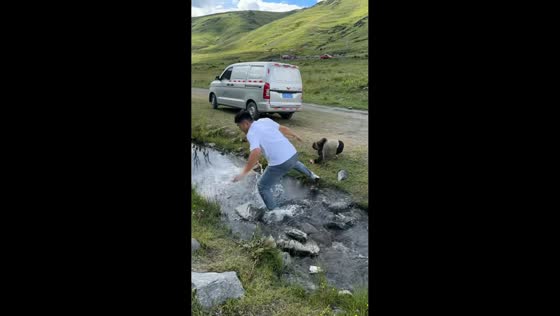 Funny father and son bonding moment during water crossing in Jiangsu, China