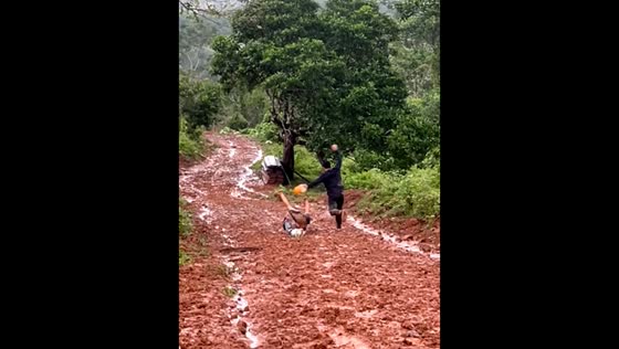 Man slips during muddy downhill run in Puerto Cabezas, Nicaragua