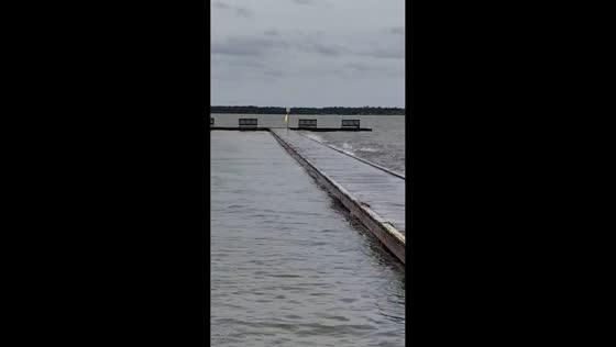 Pier boardwalk flooded by high tide in Emerald Isle, North Carolina