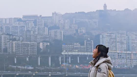 Woman playfully pretends to eat a train in Shaanxi, China