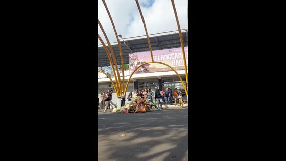 Woman collapses under costume during Banyuwangi Ethno Carnival in Indonesia