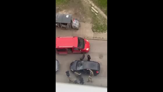 Man throws crutch and runs from military escort in Lutsk, Ukraine